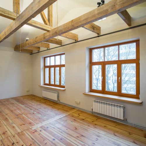Wooden design. Room studio with a kitchen. Big wooden window.