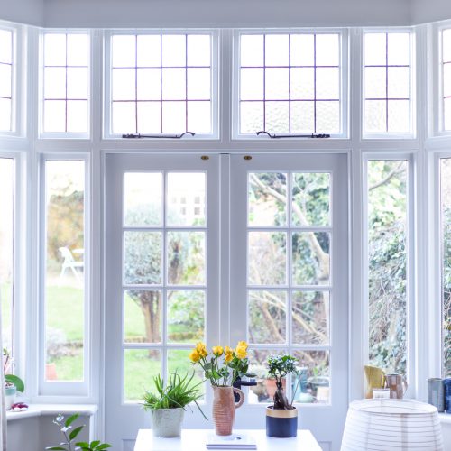 Stylish room interior with french doors and light neutral colours in a modern home