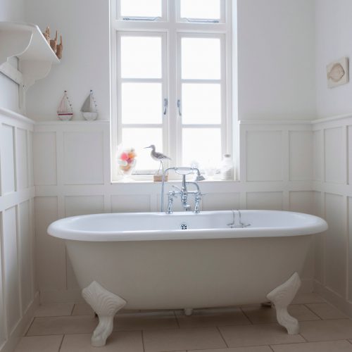 Freestanding bathtub in bathroom