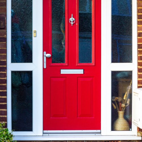 Vibrant and dynamic red wooden front door