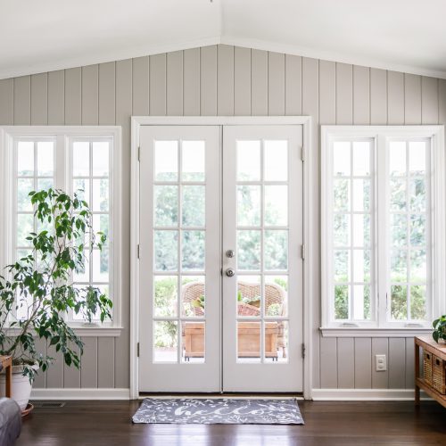 Large and open living room den sun room with windows on two side